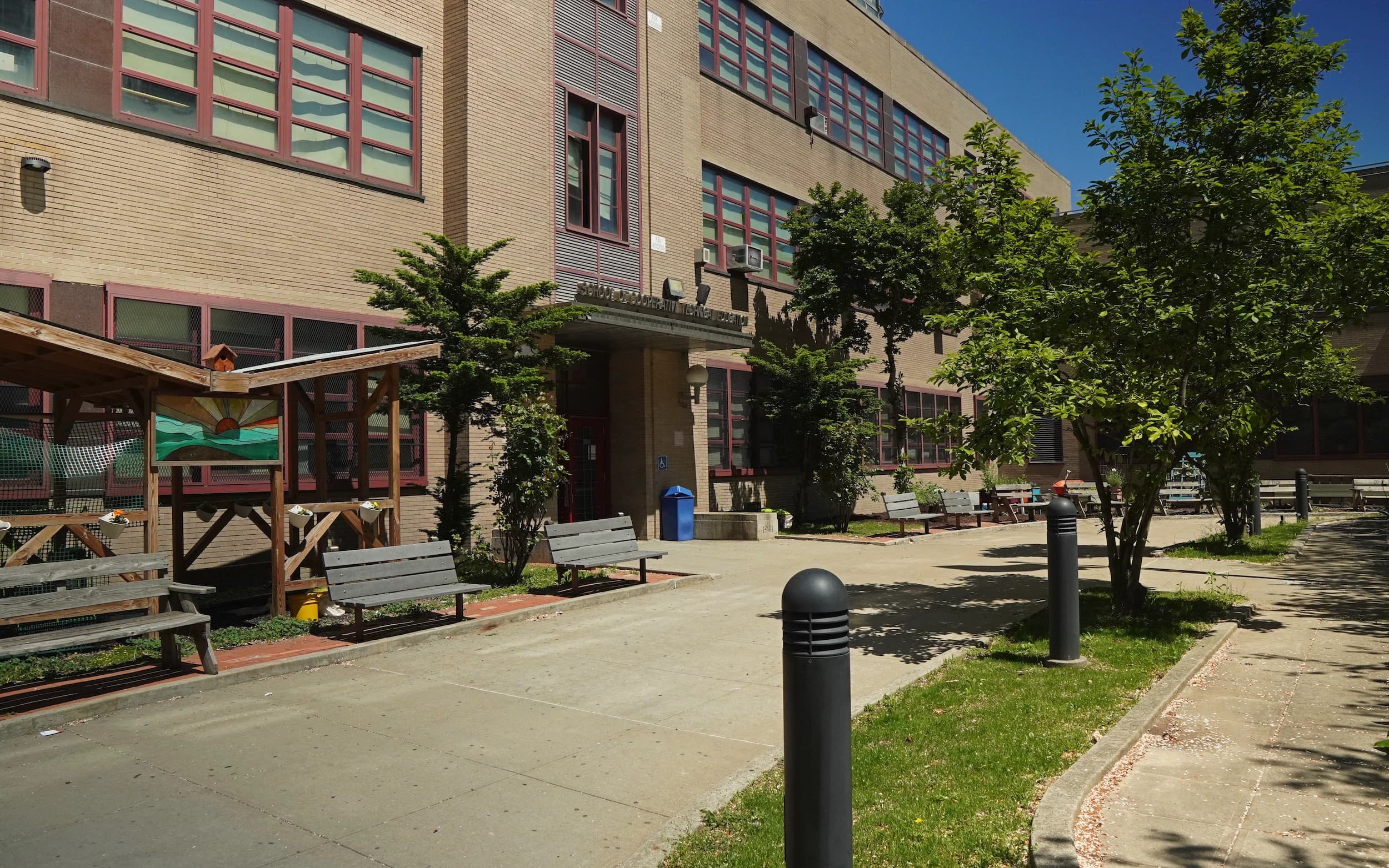 Courtyard outside a Coop Tech brick campus building